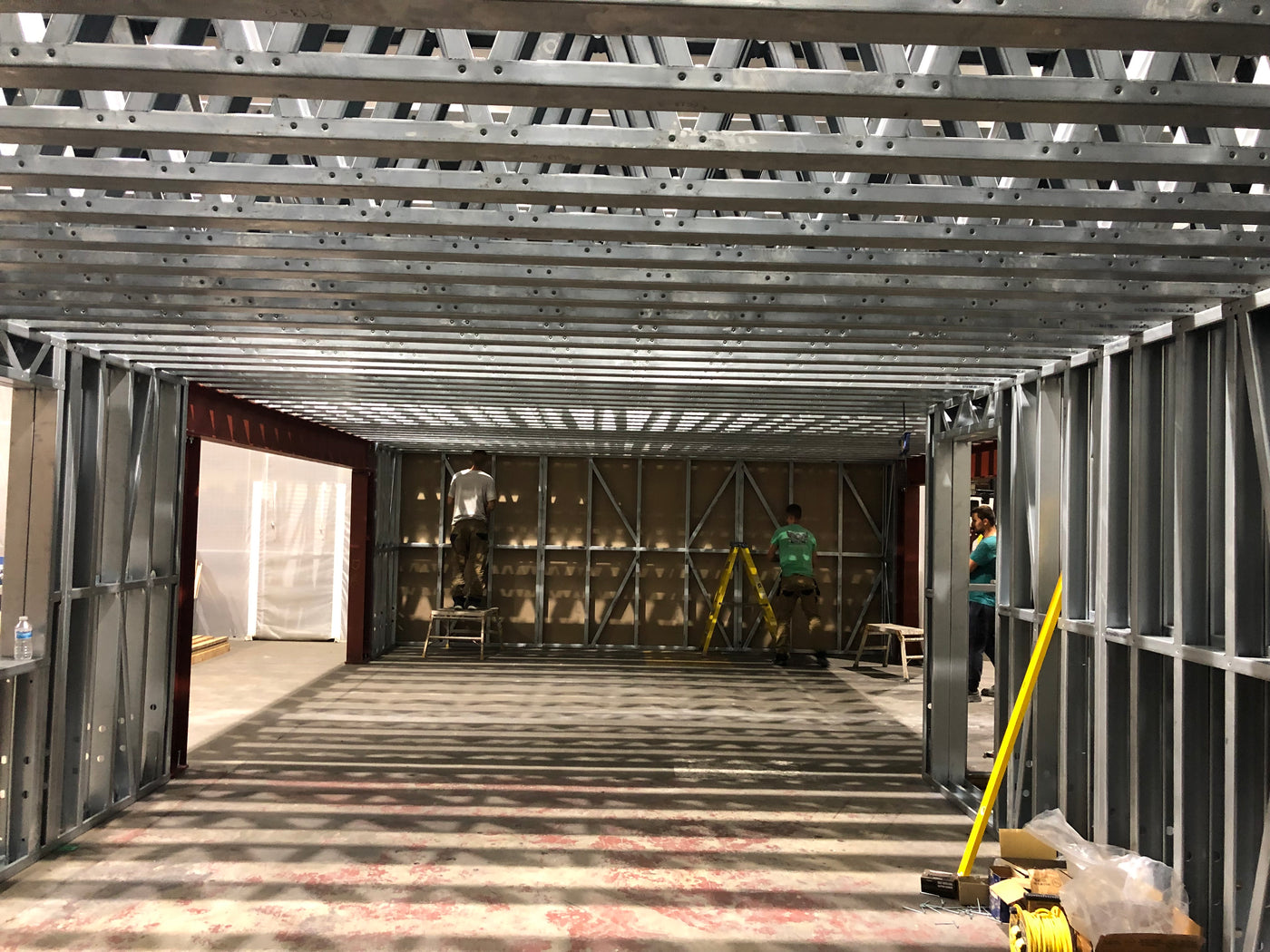 Underconstruction building with metal framing and tools visible
