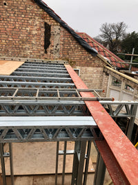 Construction site with scaffolding on a brick building
