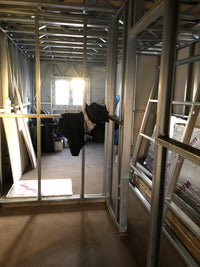 Ceiling with metal framing and insulation, showing construction or renovation work.