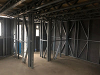 Underconstruction building with metal frame and exposed ceiling